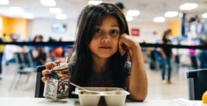 Feeding America stock image of girl with milk