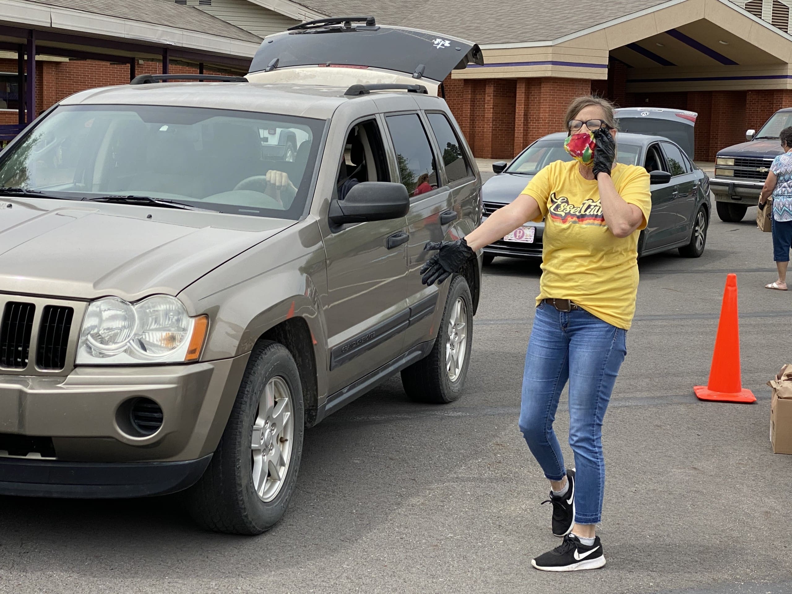 Woman directs traffic at distribution