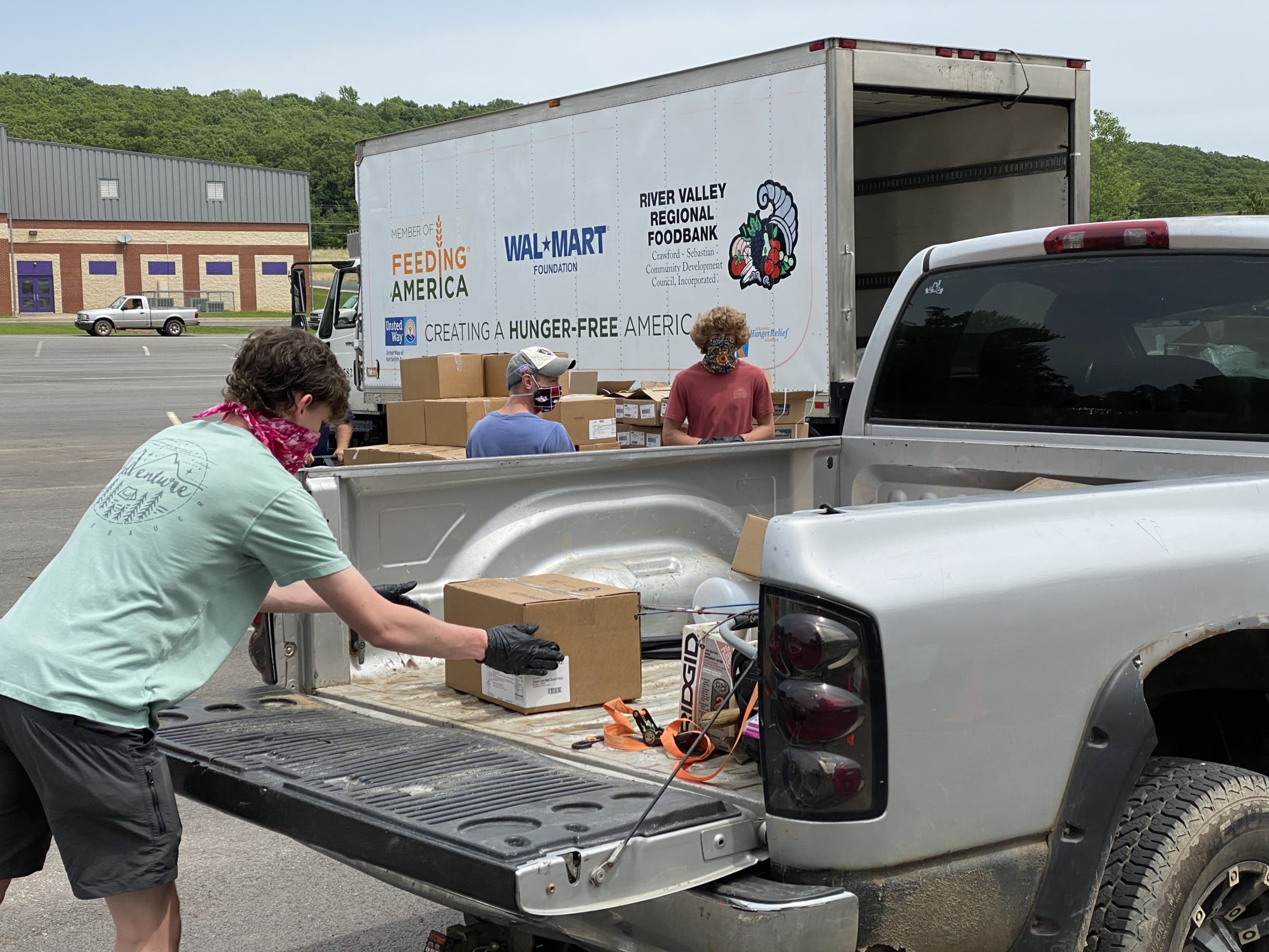 Volunteers load boxes